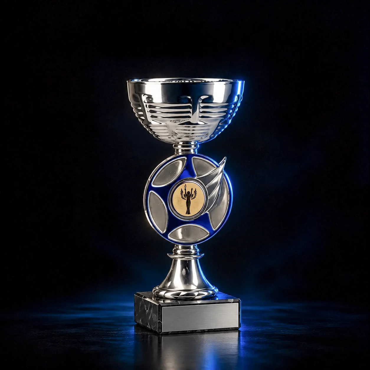 Silver and blue trophy cup with a gold centre on a marble base
